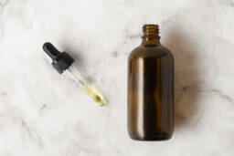flat lay bottle oils with pipette flat lay bottle oils with pipette