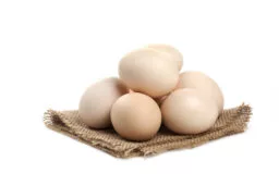 three fresh organic raw eggs isolated white surface